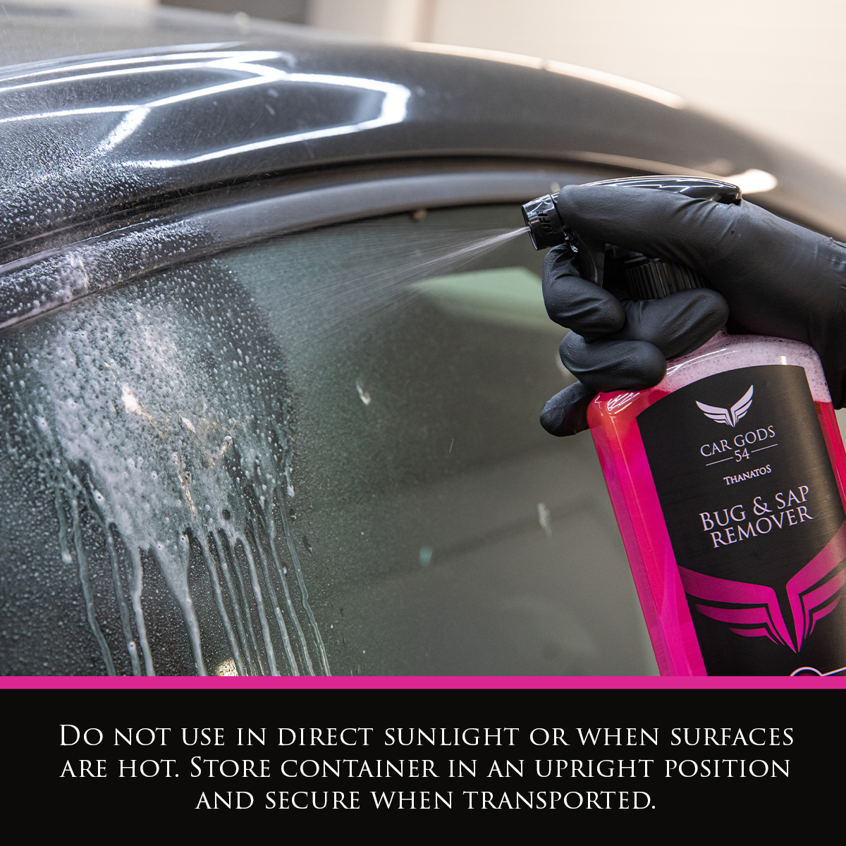 Image shows bottle of Car Gods Bug & Sap Remover being sprayed onto the roof of a car. Text: Do not use in direct sunlight or when surfaces are hot. Store container in an upright position and secure when transported.