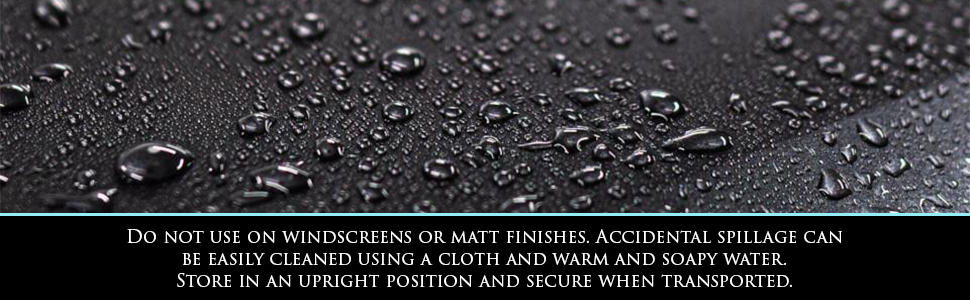Image shows water beading on the hydrophobic surface of a black vehicle treated with Car Gods Ceramic SiO2 Hybrid Wax Spray. Text: Do not use on windscreens or matt finishes. Accidental spillage can be easily cleaned using a cloth and water. Store in an upright position and secure when transported.