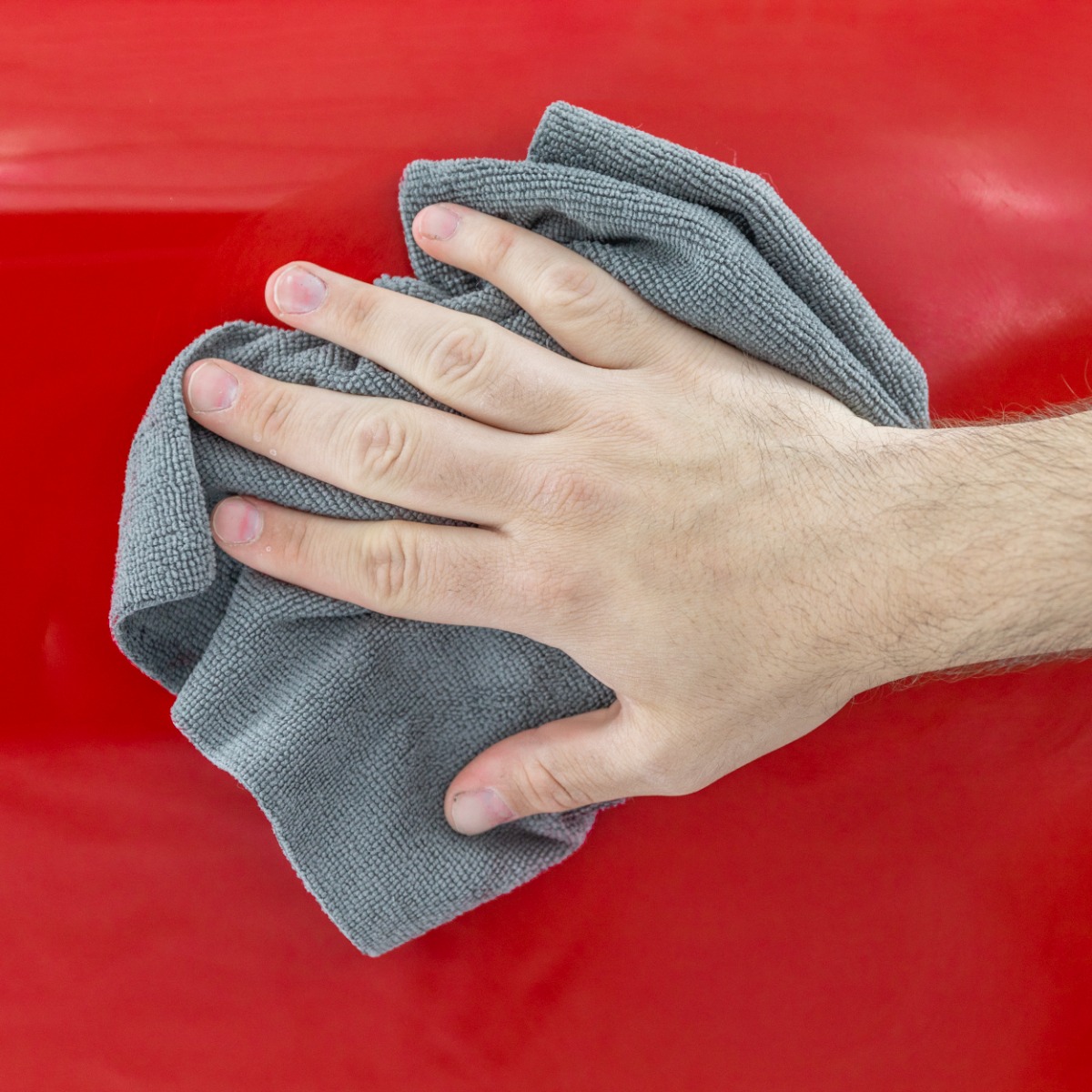 Wiping excess product from car body