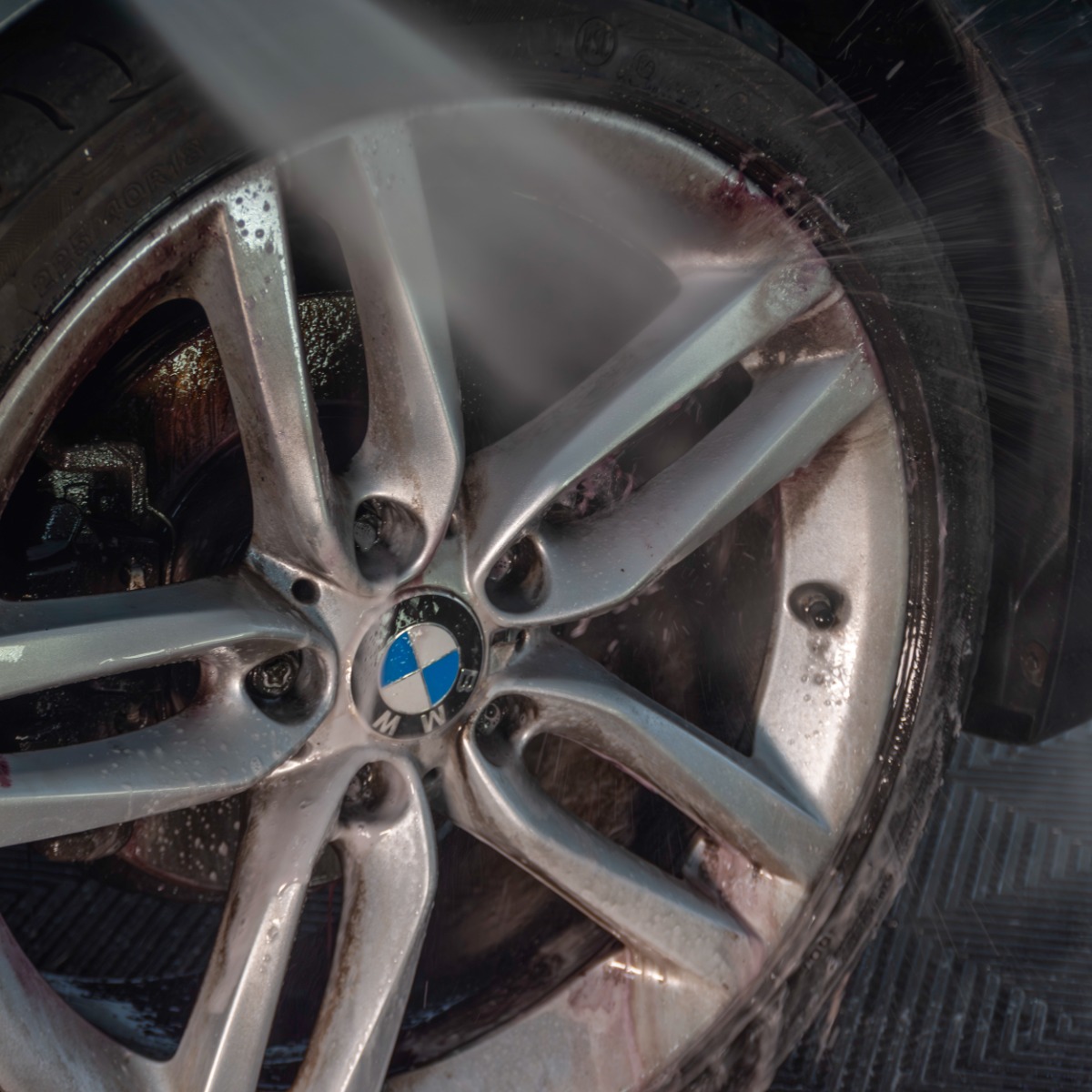 Pressure washing car wheel